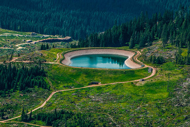 View of an artificial lake from the top of Heritage, World Heritage Site, Mountain, Colorful, Rock, Europe, Italy, Wild, High, Tyrol, Alps, Dolomites, Trentino, Laurin, Kalkalpen, Limestone Alps, Rosengarten, Catinaccio, Mountainscape, Vajolet, Laurino, Unesco, Vaiolet, Alto Adige, South Tyrol, Eastern Alps,  Landscape, 2021, Color image, Outdoors