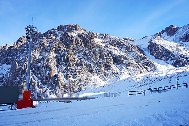 istock Medeo. A mountain gorge, with different vegetation and fir trees. First snow. 2246304247