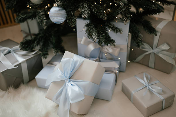 istock Festive Gifts Under Christmas Tree with Elegant Ribbons 2246305754