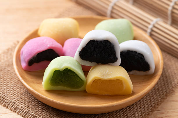istock Daifuku mochi (Traditional Japanese sweet) stuffed with soybean, matcha green tea, sesame seed and red bean paste 2246307608