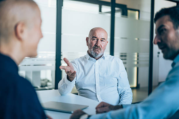istock Group of businesspeople talking in the office. 2246309052