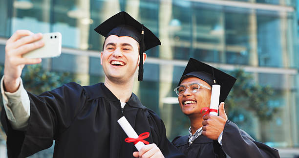 istock Graduation, selfie and men with certificates, university and celebration for milestone and ceremony. Happy, students and people with robes for event, education and profile picture on social media 2246309556