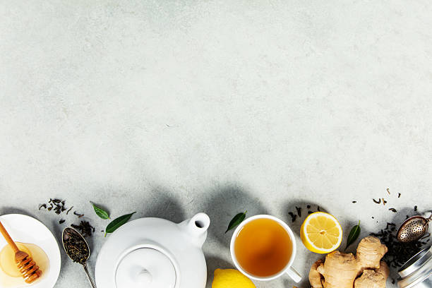 istock Herbal Tea with Ginger, Lemon, and Honey on Light Background 2246312876