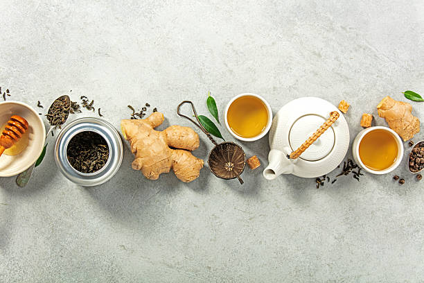 istock Tea Ingredients and Teapot with Cups on Stone Background 2246312878