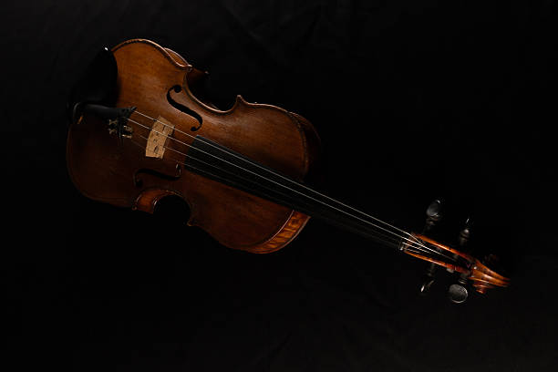 istock old violin placed on a table covered with black cloth 2246319001