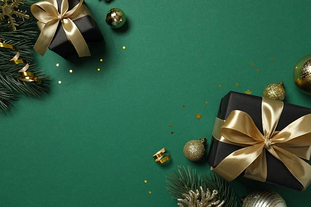 istock Beautiful frame with gift boxes on green background, Christmas concept 2246319291