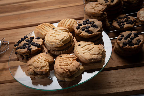 istock Butter cookie shortbread homemade baked chocolate chip stack rustic dessert sweet crumbly plate of homemade butter cookie and shortbread stack wooden table, some topped with chocolate chip 2246319310
