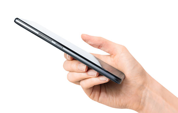 A woman's hand holds a smartphone on a white isolated background, side view