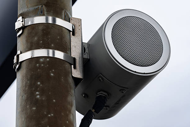 istock Modern sound speaker mounted on a utility pole in urban area 2246323589
