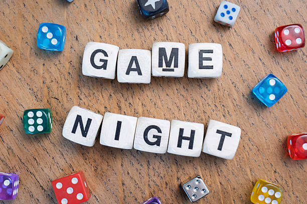 istock GAME NIGHT spelt using wooden word dice over a pale wooden tabletop. 2246323810