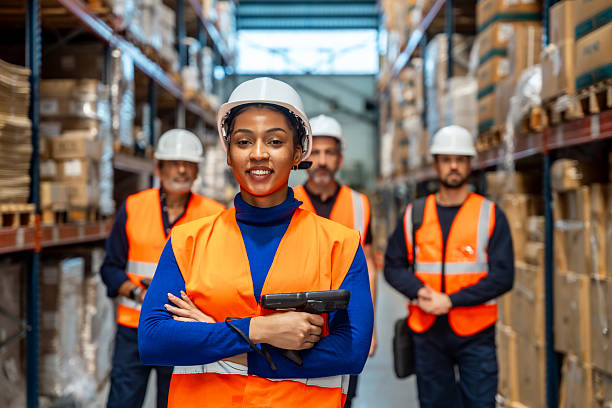 istock Diverse warehouse team standing together in logistics facility 2246324248