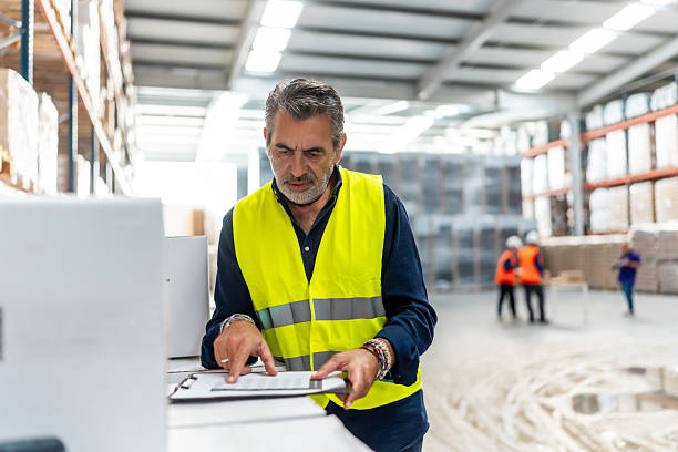 istock Warehouse manager checking inventory during supply chain activities 2246324417