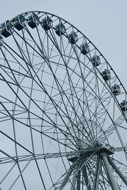 istock large ferris wheel, stormy sky 2246324582