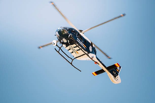 National Police Air Service helicopter (NPAS) on a patrol over the skies of Salford on behalf of Greater Manchester Police. NPAS are the UK force for supplying air support to police officers on the ground.