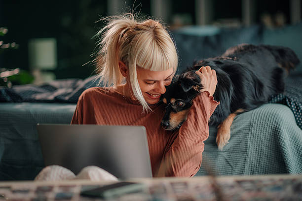 istock Woman working from home hugging her dog 2246327825