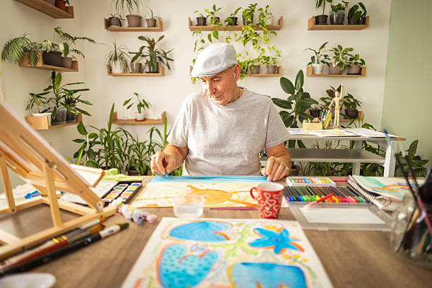 istock Senior Man Painting Sunny Scene 2246327891