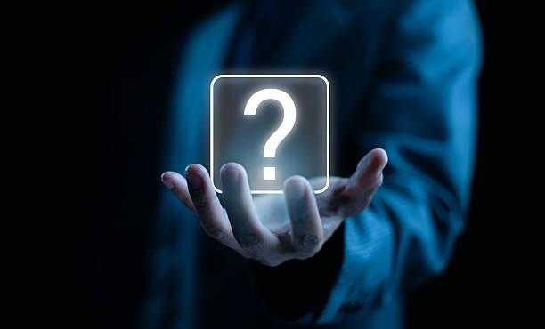 istock Business concept of innovation and problem solving, showing a glowing question mark icon hovering above a businessman's hand, symbolizing curiosity, decision making, leadership, and creative thinking. 2246328005