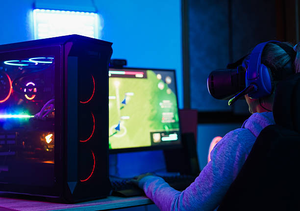 istock Gamer playing at strategy pc game online using vr ai headset - Gaming and young people generation lifestyle concept - Focus on headphones 2246328264