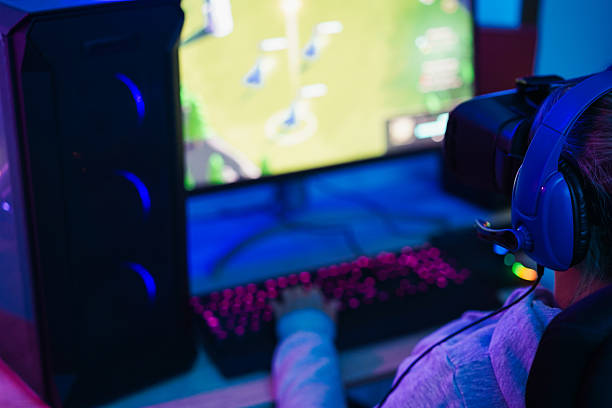 istock Gamer playing at strategy pc game online using vr ai headset - Gaming and young people generation lifestyle concept - Focus on headphones 2246328269
