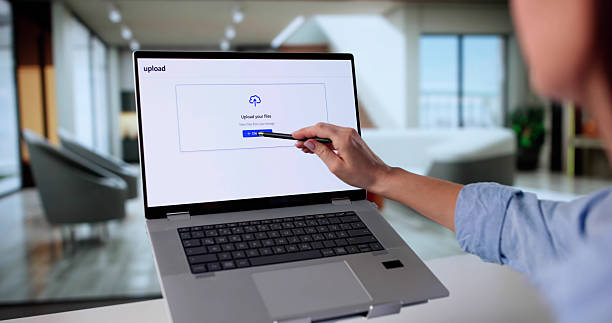 istock Young Woman Uploading Photo Into Online Cloud Storage For Future Security 2246330760