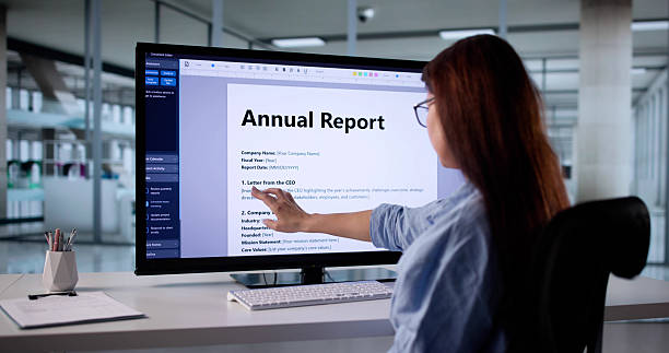 istock Woman Analyzing Business Revenue Financial Report Document Online 2246330792
