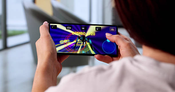 istock Young Woman Playing Online Video Game On Mobile Phone For Fun 2246331091