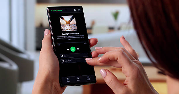 istock Young Woman Selecting Songs On Smartphone, Aspiring DJ 2246331102