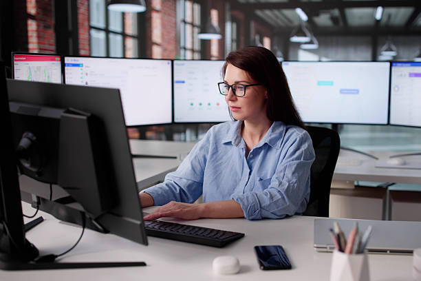 istock Woman Managing Company Payroll And CRM On Desktop Computer Screen 2246331744