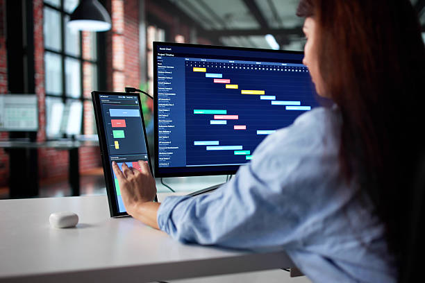 istock Woman In Business Attire Analyzing Data 2246331801