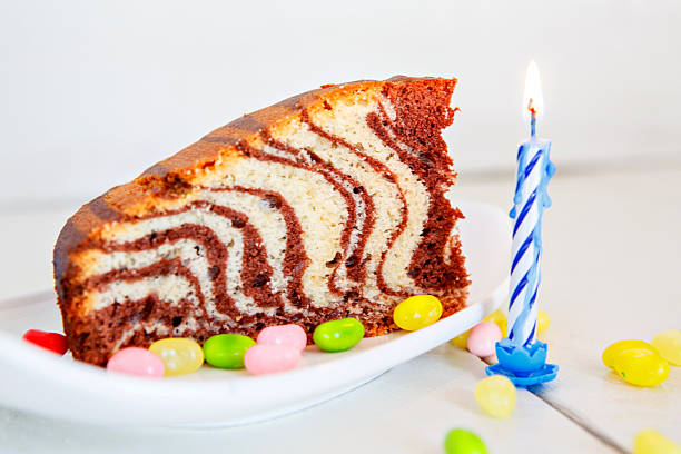 birthday zebra vanilla chocolate cake with chocolate and one blue candle