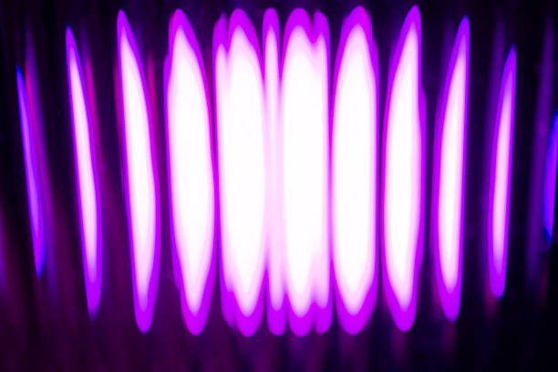 Abstract image of vertical light columns in vibrant purple and bright white, creating an intense, futuristic, and hypnotic digital pattern.
