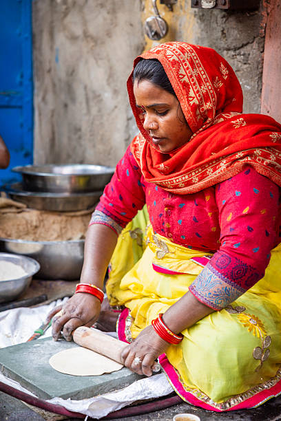 istock Woman Rolling Roti, Jaipur, India 2246337178