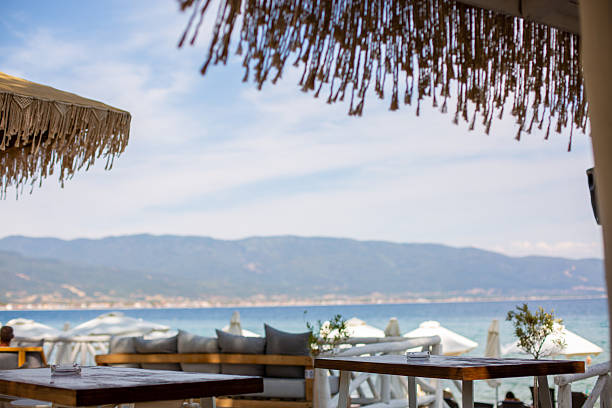 istock Relaxing beach bar lounge with ocean view 2246337562