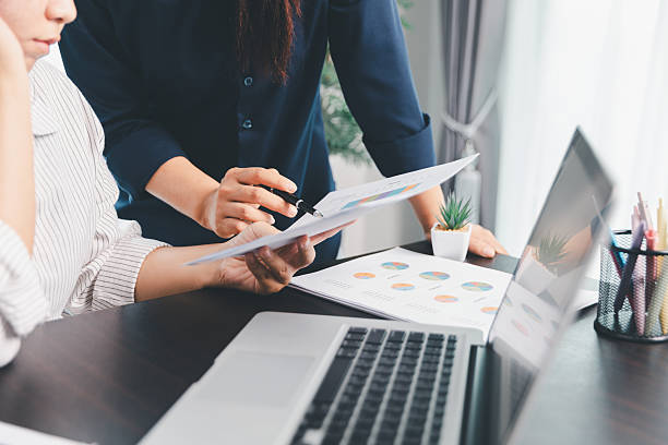 istock Business meeting, data analytics or women with graph presentation in office. Chart, analysis accounting team brainstorming economy, inflation or solution. business project finance investment concept. 2246338383