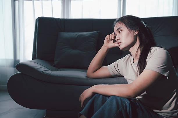 istock Sorrowful woman sat alone, overwhelmed by emotion, her sad and unhappy expression revealing deep despair, stress and distress left feeling depressed. sorrowful sad, despair alone, depressed stress 2246338423