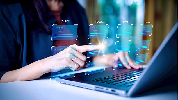 istock Digital project management and workflow automation concept. Businesswoman using laptop and virtual interface to track task progress and productivity, data analytics, and smart technology innovation. 2246339927