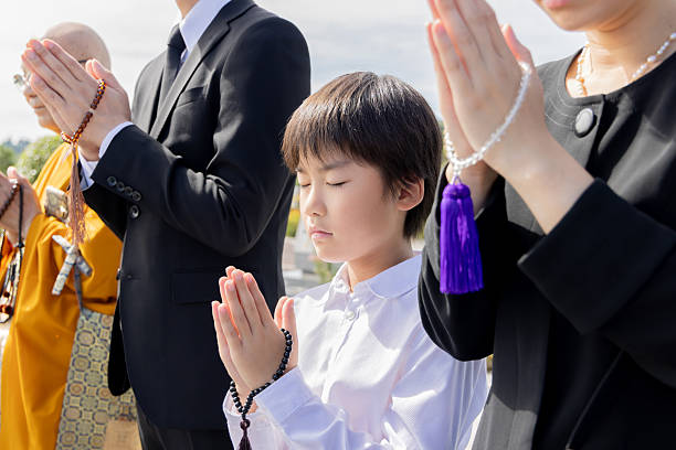 istock Asian family visiting the grave 2246340187