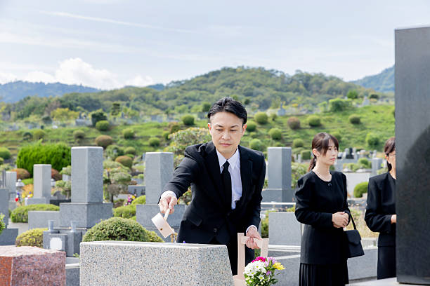 istock Asian family visiting the grave 2246340731