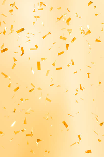 istock Golden confetti falling on a bright background. Festive and joyful backdrop for celebrations, parties, weddings, birthdays, Valentine’s Day, Mother’s Day, and holiday events. 2246340862