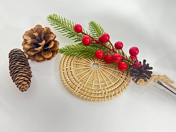istock Rustic Arrangement of Pine Cones, Greenery, and Berries on Textured Mat for Natural Home Decor and Seasonal Display Ideas 2246342621