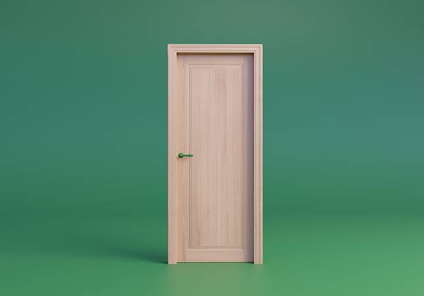 istock 3d wooden door isolated on green background. 2246343271