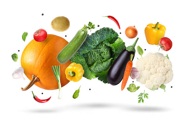 istock Different fresh vegetables in air on white background 2246343326