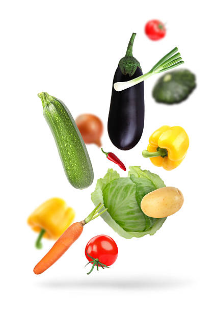 istock Different fresh vegetables in air on white background 2246343361