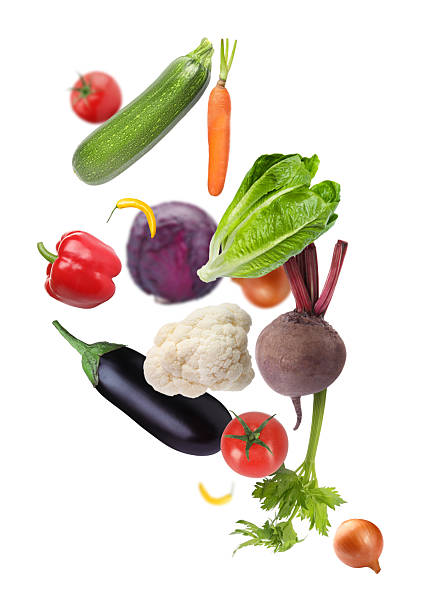 istock Different fresh vegetables in air on white background 2246343430