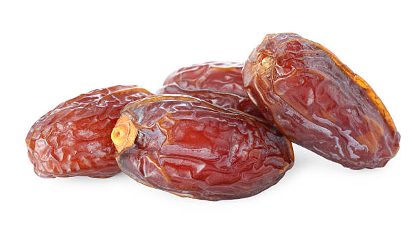 istock Many tasty dried dates isolated on white 2246344197