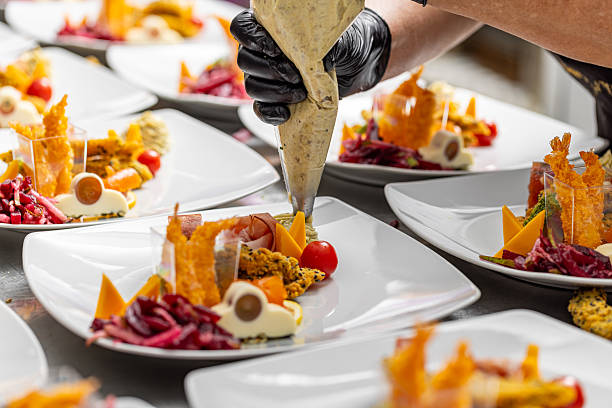 istock Chef is garnishing delicious appetizer dishes 2246345485