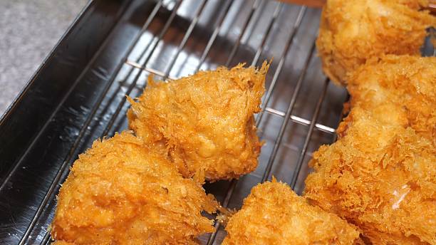 istock Freshly deep fried panko cutlets draining on a metal tray 2246350515