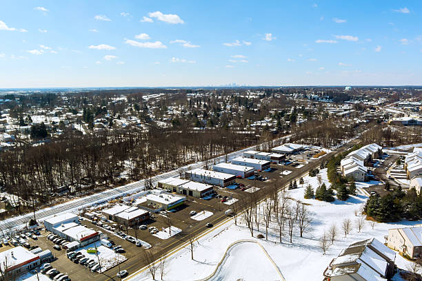 istock Winter landscape showing bustling shopping area surrounded by snow covered trees 2246351626