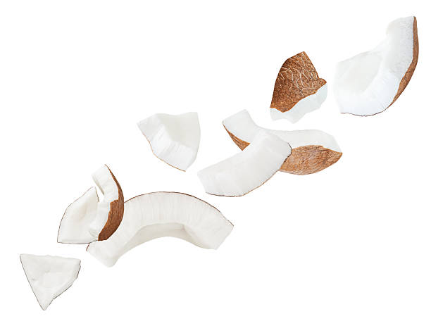 istock Levitating coconut  pieces isolated on white background. High Quality  Flying Broken coconut  chunks. Coco nut explosion. Top view. Flat lay. 2246355086