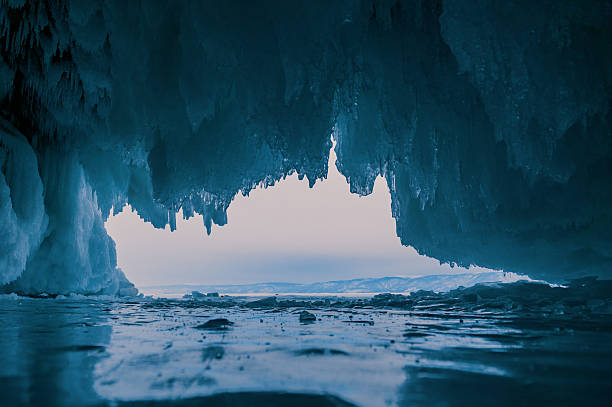 istock Inside a stunning ice cave on Lake Baikal, large icicles hang from the ceiling, creating a breathtaking winter landscape. Snow-covered mountains can be seen far in the distance. 2246356282